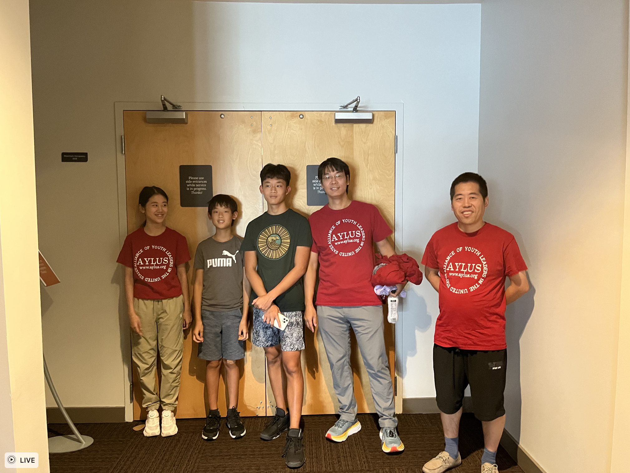 AYLUS Orlando members pose for a group picture after hard work.
