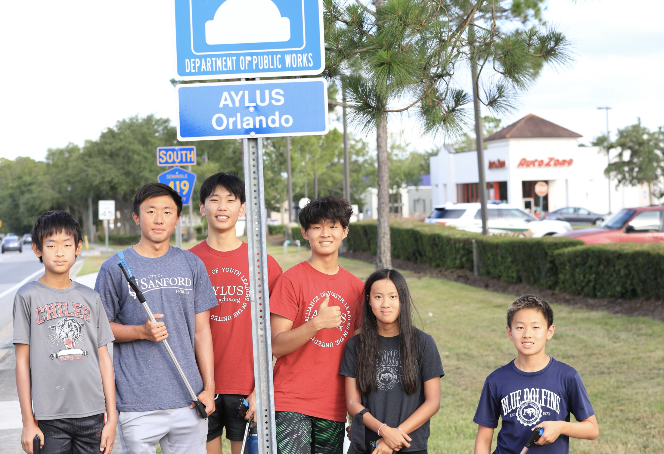 AYLUS Orlando members pose for a group picture after hard work.